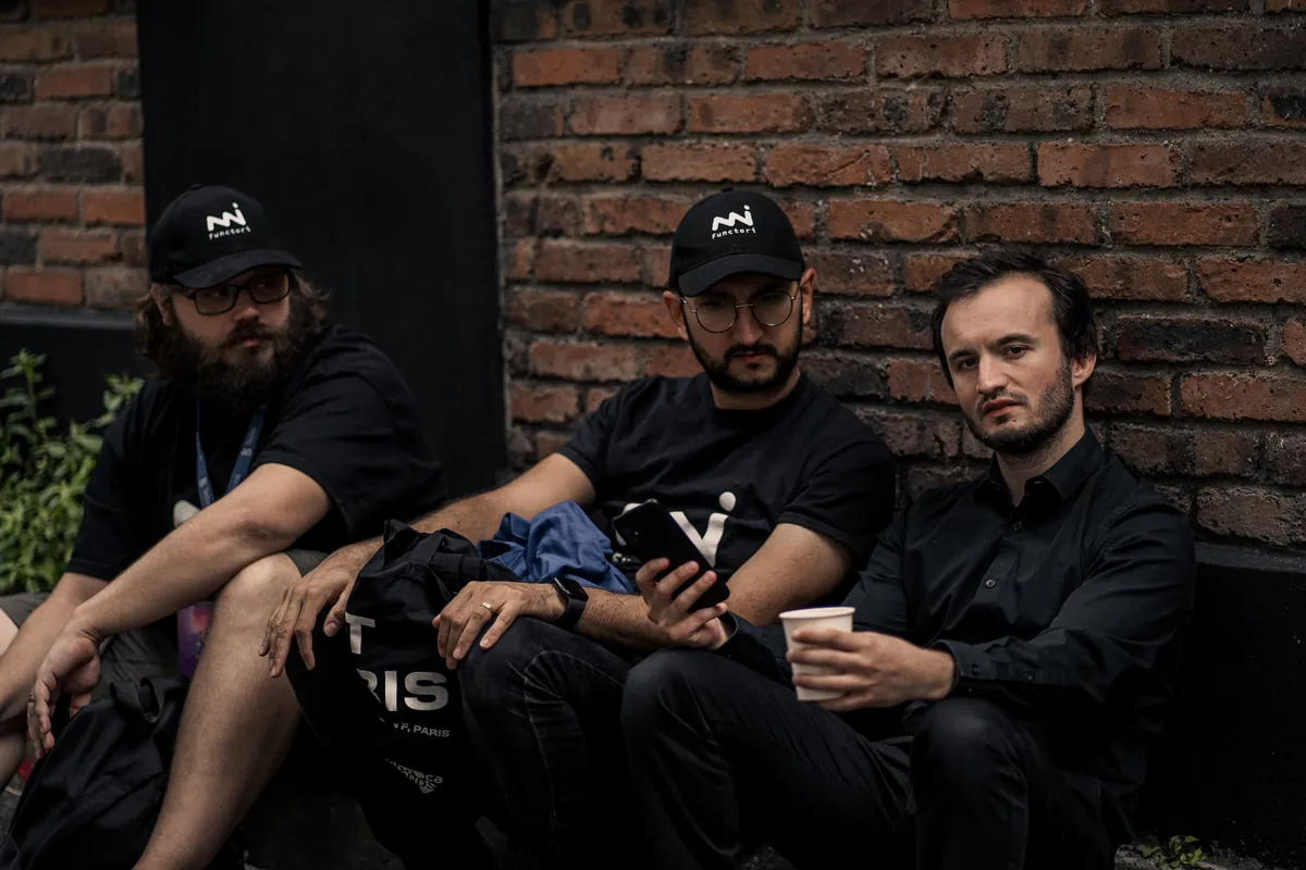 Three of the founders at an event